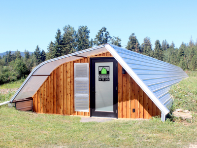 exterior view of the greenhouse in the snow in summer