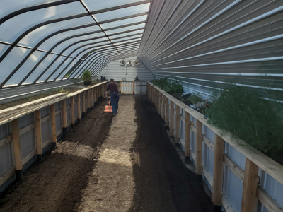 interior of the greenhouse getting prepped for planting